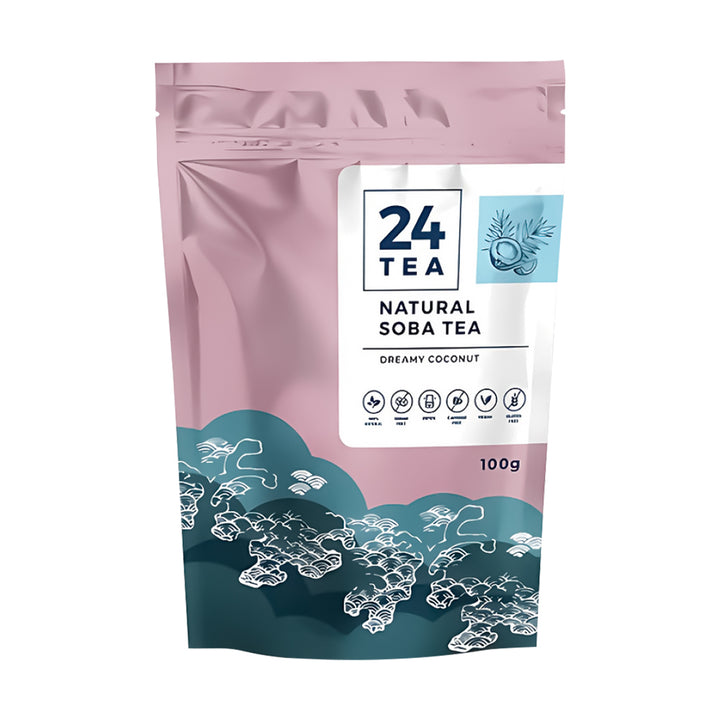 A 100g stand-up pouch of 24 Tea Natural Soba Tea in Creamy Coconut flavor. The packaging features a dusty pink upper section, a white central label with the brand logo, and a dark teal wave design at the bottom with white line-art illustrations.