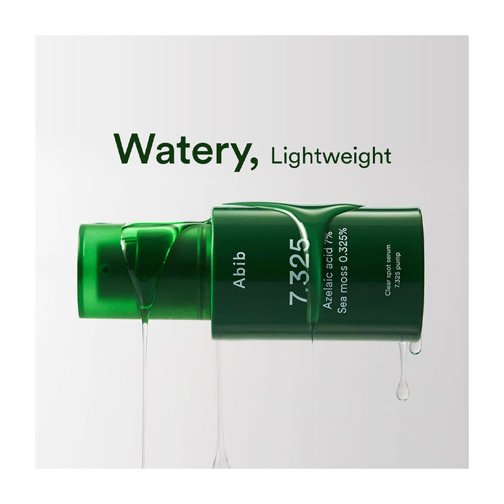 A green cosmetic tube labeled &