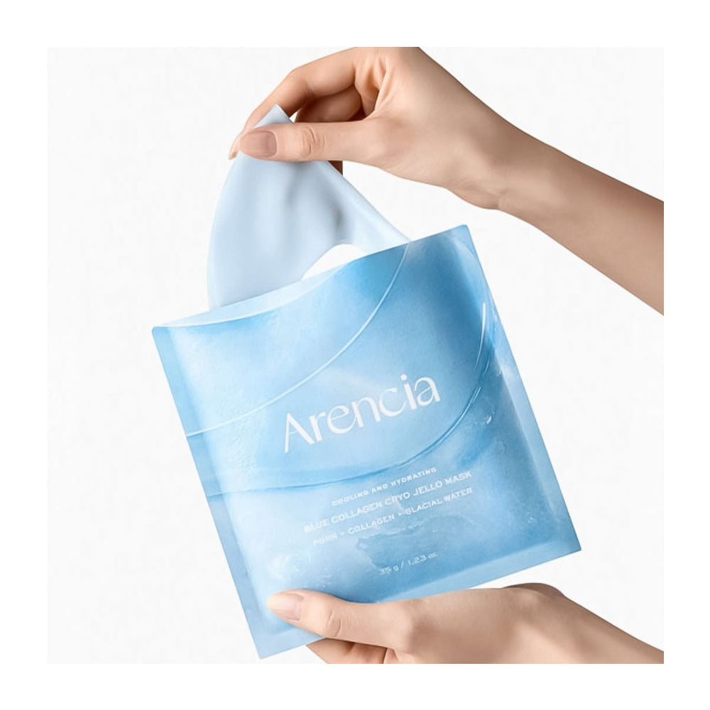 Hand holding a blue packaging of Arencia product on a white background