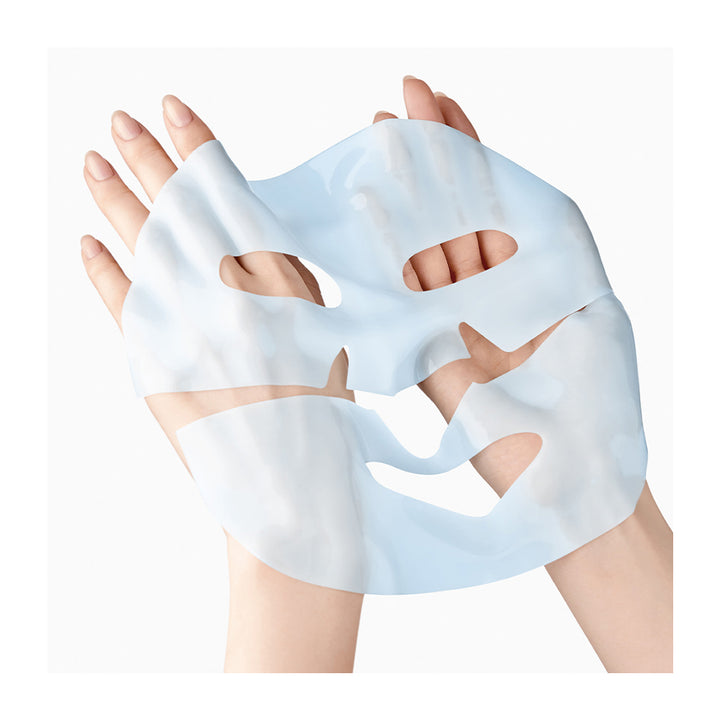 Hands holding a light blue sheet mask against a white background