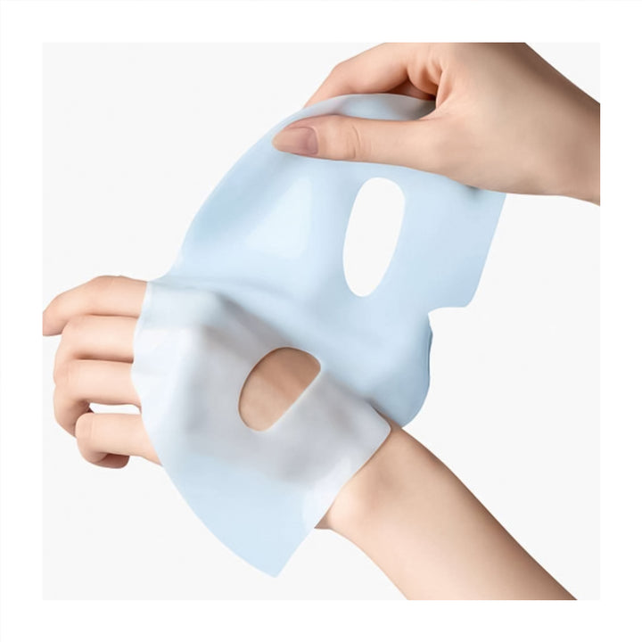 Silicone face mask held by a hand on a white background