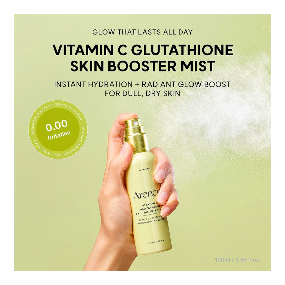 A hand holding a bottle of Arene Vitamin C Glutathione Skin Booster Mist against a pale green background with product text and a white mist effect.