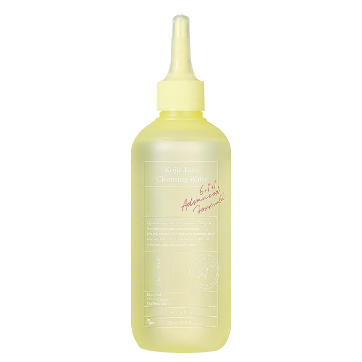 A 250ml bottle of Kojic-Yuzu Cleansing Water with a pale yellow liquid inside and a matching pale yellow dropper cap, shown on a solid white background.