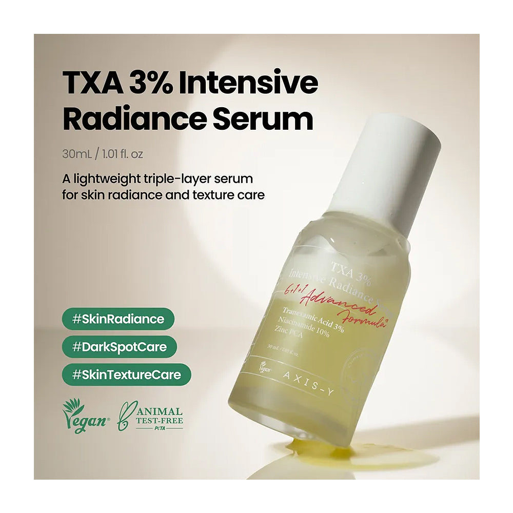 A bottle of TXA 3% Intensive Radiance Serum by AxiS-Y, shown at an angle with a small pool of golden serum beneath it. The background is a soft beige with product details and green hashtag badges on the left.