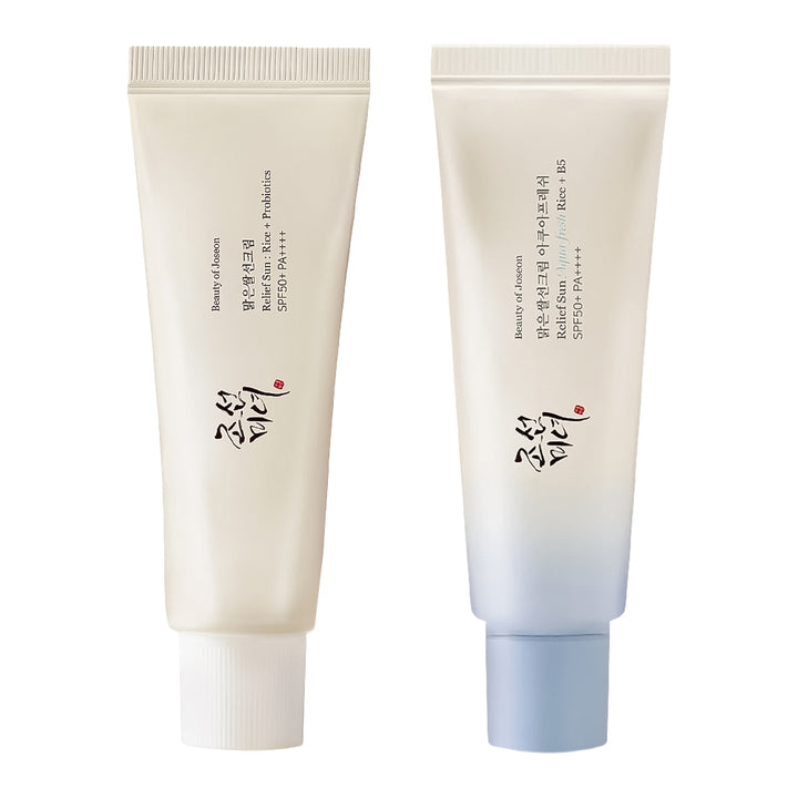 Two cosmetic face tubes from Beauty of Joseon, shown side by side on a white background. The left tube is off-white with black and red text, and the right tube is white fading to light blue at the bottom with a light blue cap.