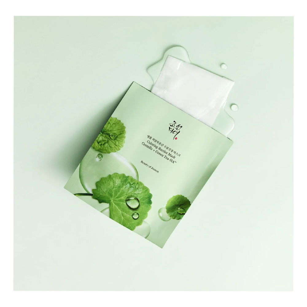 A single sheet mask packet with a white mask partially pulled out, decorated with green leaf graphics and water droplets on a pale mint background.