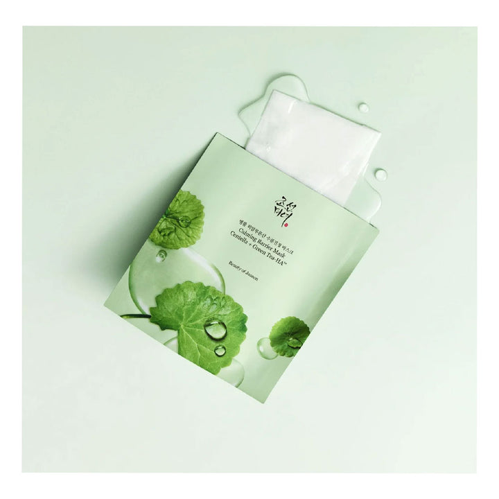 A single sheet mask packet with a white mask partially pulled out, decorated with green leaf graphics and water droplets on a pale mint background.