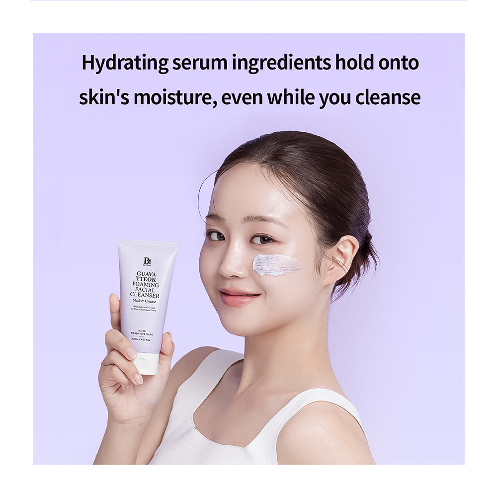 A woman with dark hair pulled back holds a white tube of B5 BioSciences Hydrating Cleanser. She has a white cream product on her cheek, set against a light lavender background with promotional text at the top.