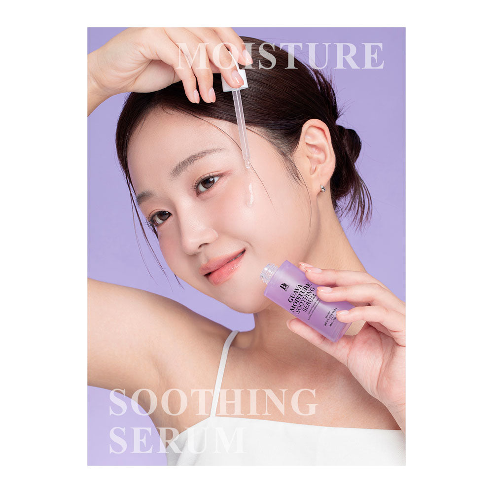 A woman with dark hair tied back holds a purple dropper bottle labeled &
