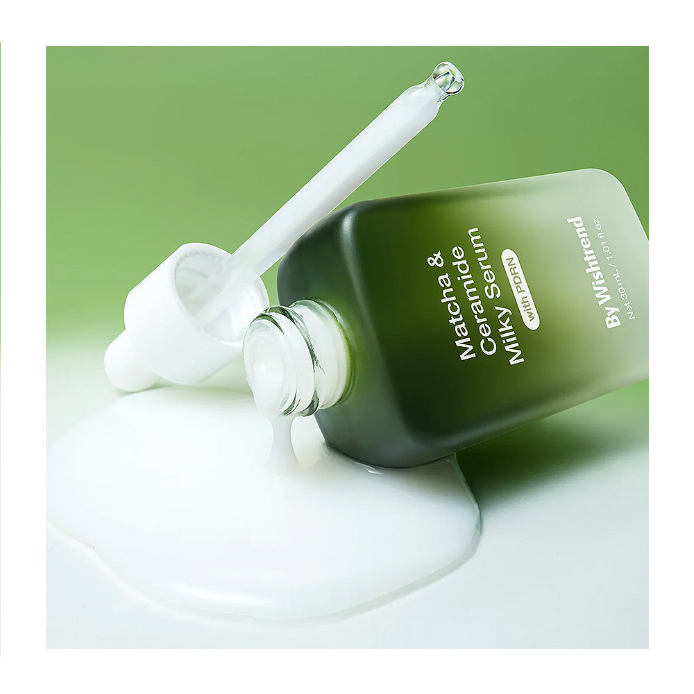 Green skincare serum bottle with dropper on a white background