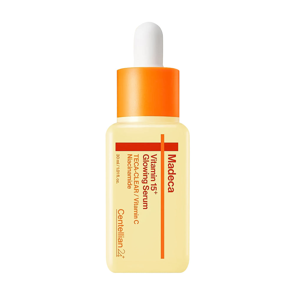 Skincare serum bottle with orange cap on a white background