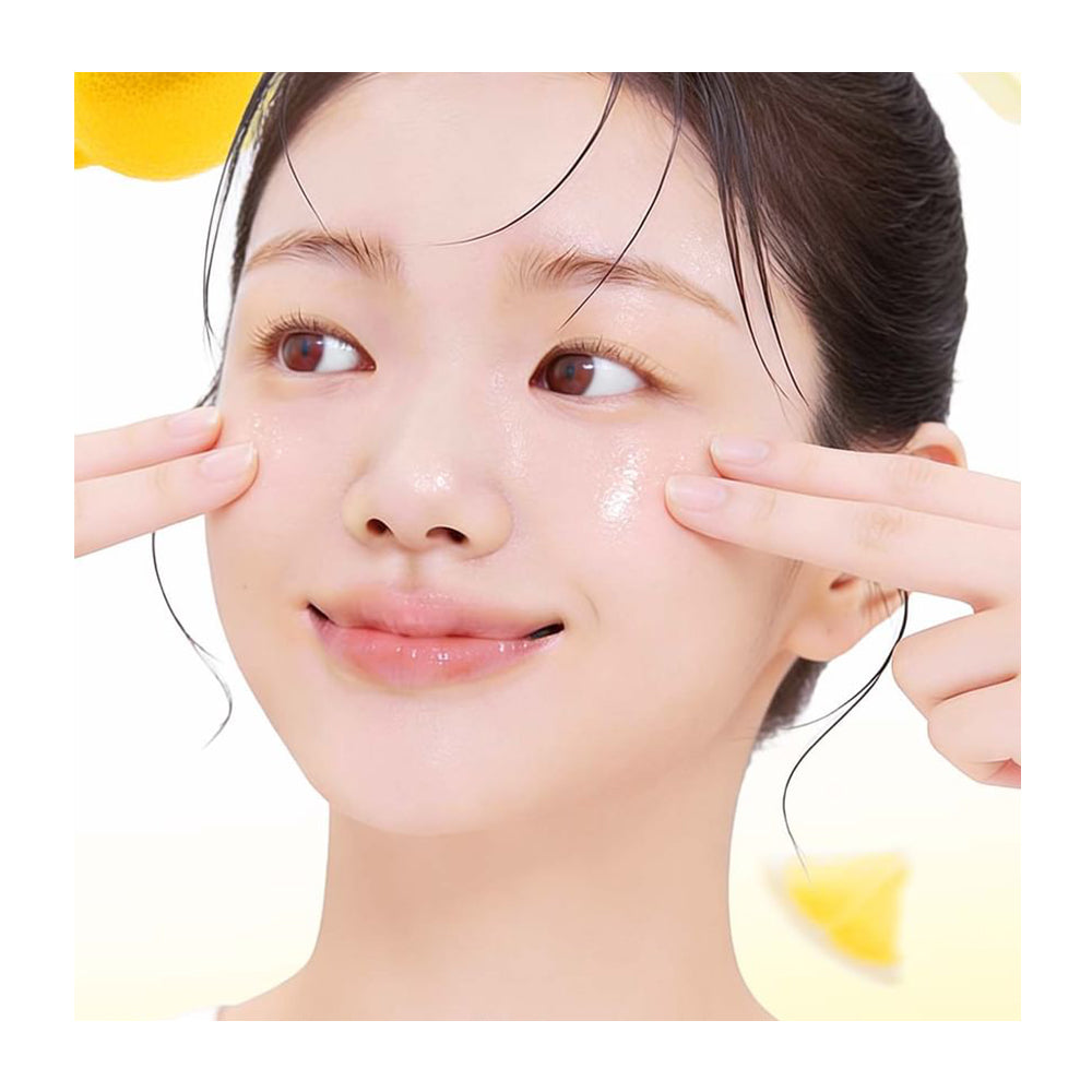 Woman applying cream to her face with a white background