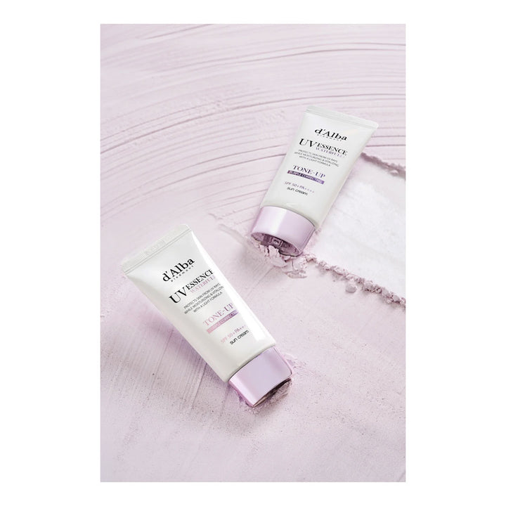 Two white cosmetic tubes from d&