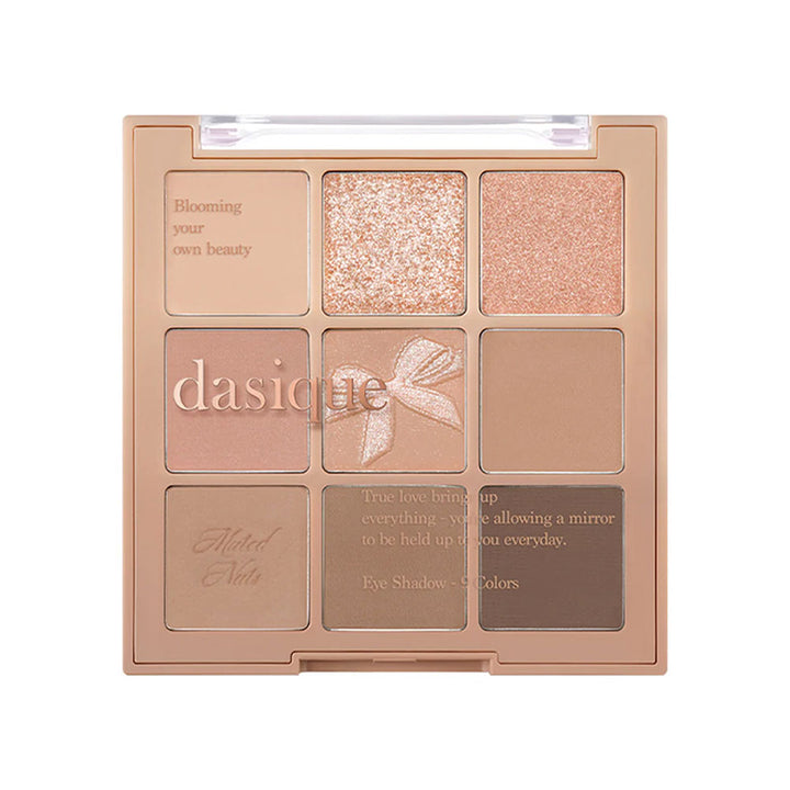 Dasique eyeshadow palette with multiple shades on a white background