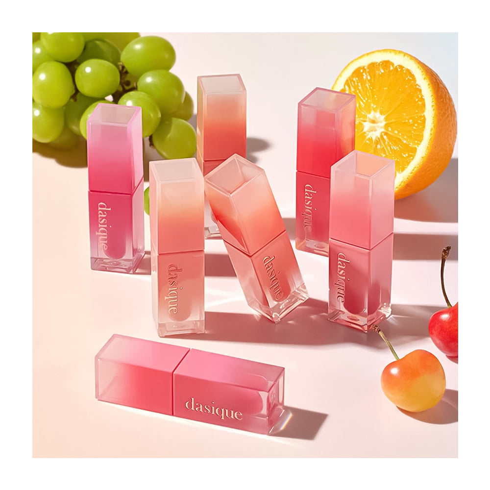dasique lip balms in pink shades with fruits on a light background