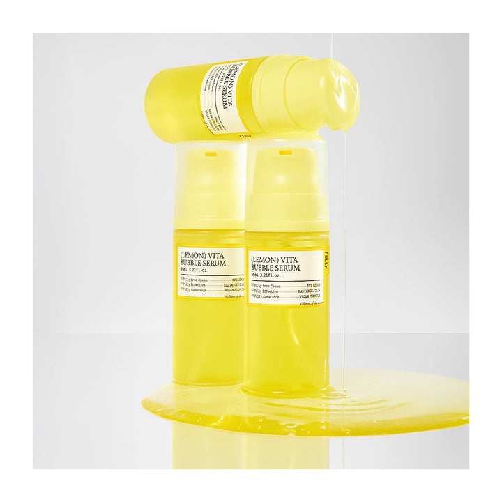 Three yellow bottles of Lemon Vita Bubble Serum on a white background