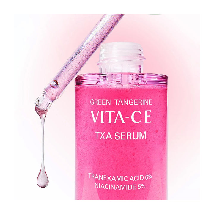 Pink serum bottle with dropper on a pink background