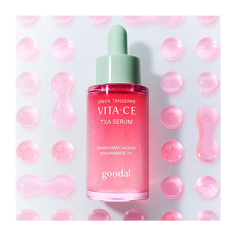 Pink serum bottle with green cap on a light pink background with pink bubbles