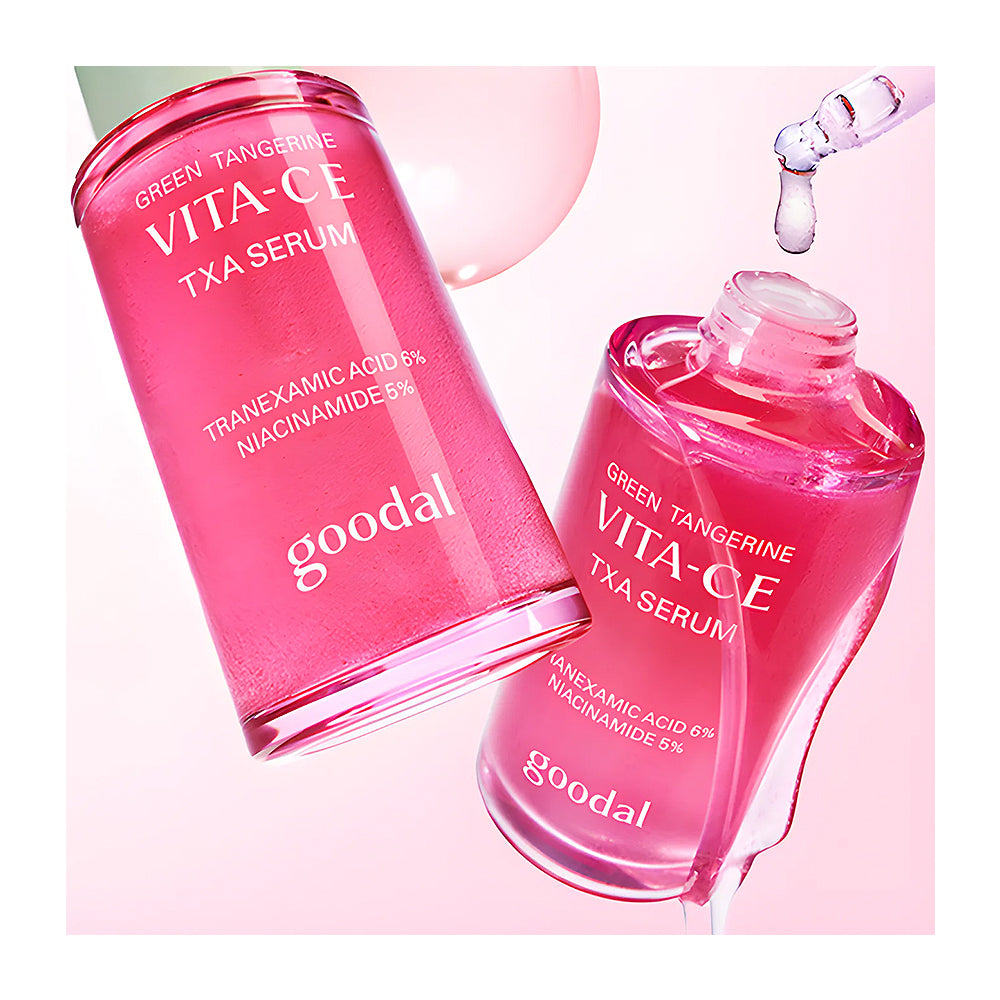 Two bottles of Goodal Green Tangerine Vita-CE TXA Serum on a pink background