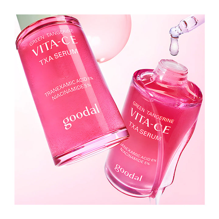 Two bottles of Goodal Green Tangerine Vita-CE TXA Serum on a pink background