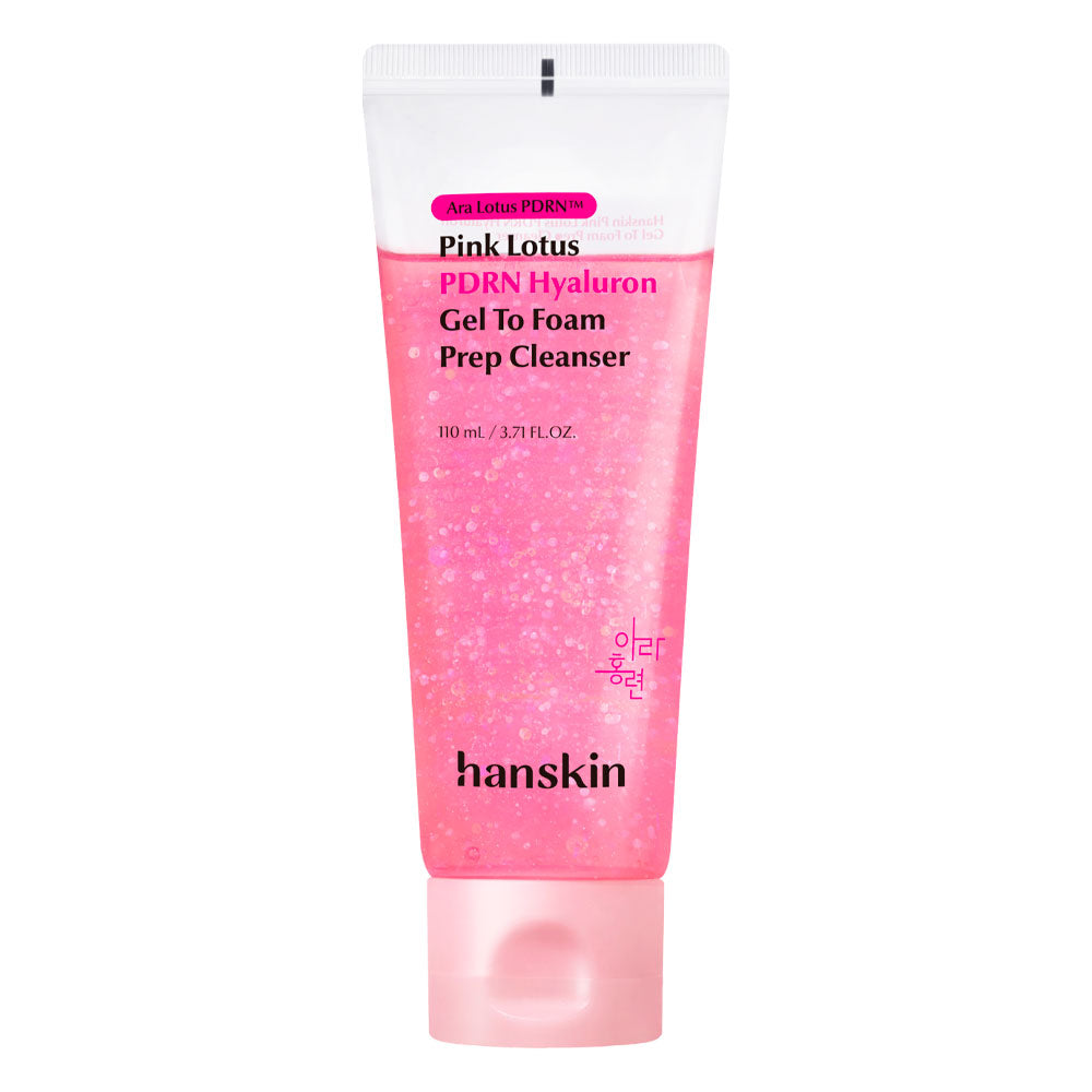 A 110 mL squeeze tube of hanskin Pink Lotus PDRN Hyaluronic Gel To Foam Prep Cleanser, featuring a pink glittery gel-filled body, a white cap, and a pink label, set against a plain white background.