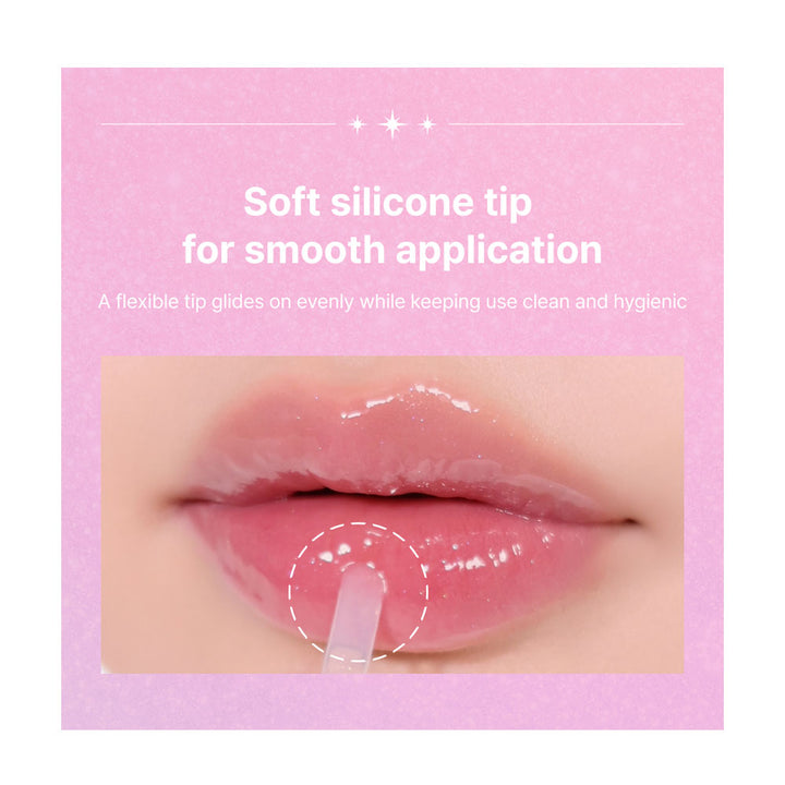 Lip product with soft silicone tip on a pink background