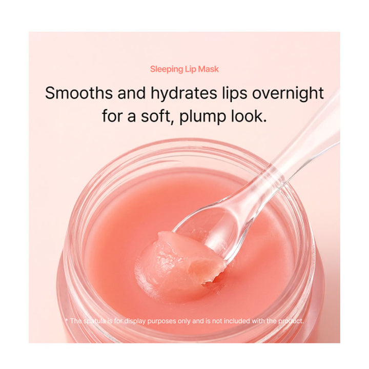 Pink lip mask with a spoonful of product on a light pink background