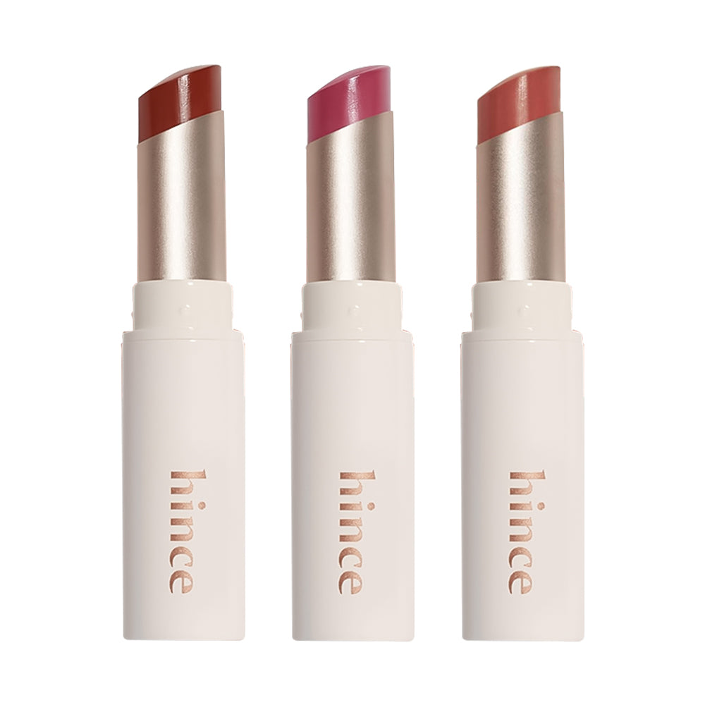 Three lipsticks with different shades on a white background, branded &