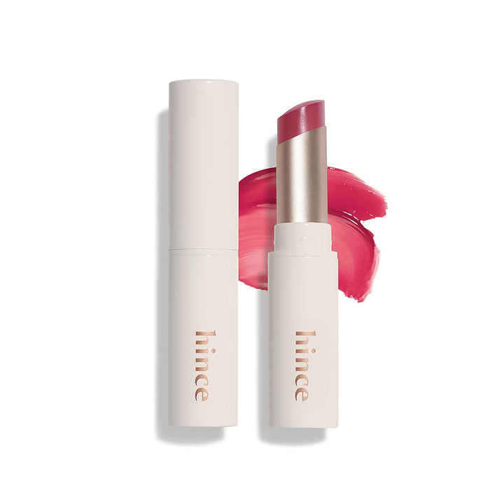 Lipstick with open case and swatch on a white background