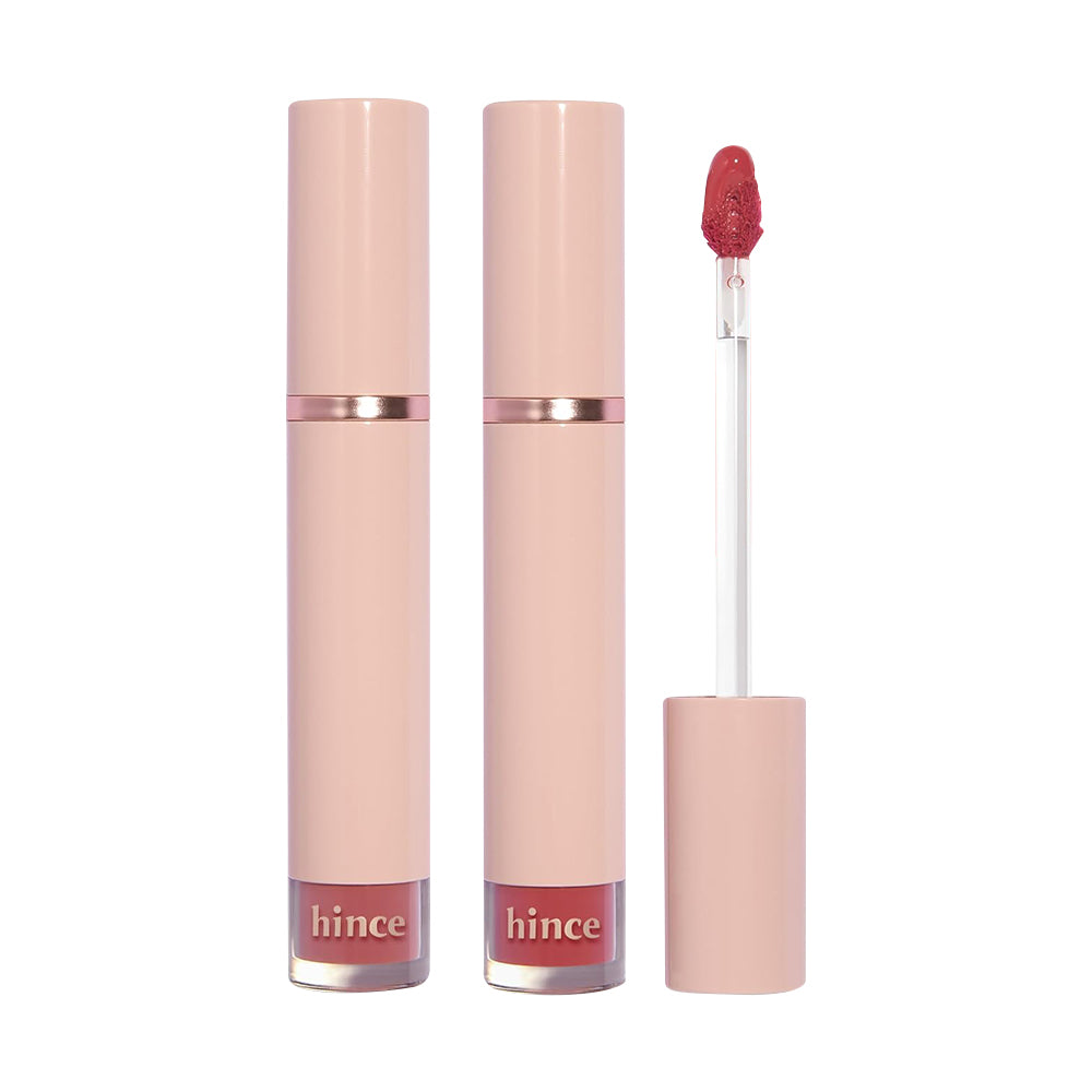Lip gloss with pink case and red shade on a white background