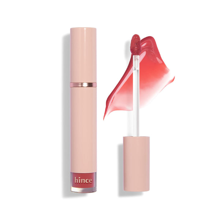 Lip gloss with pink packaging and visible brand name on a white background