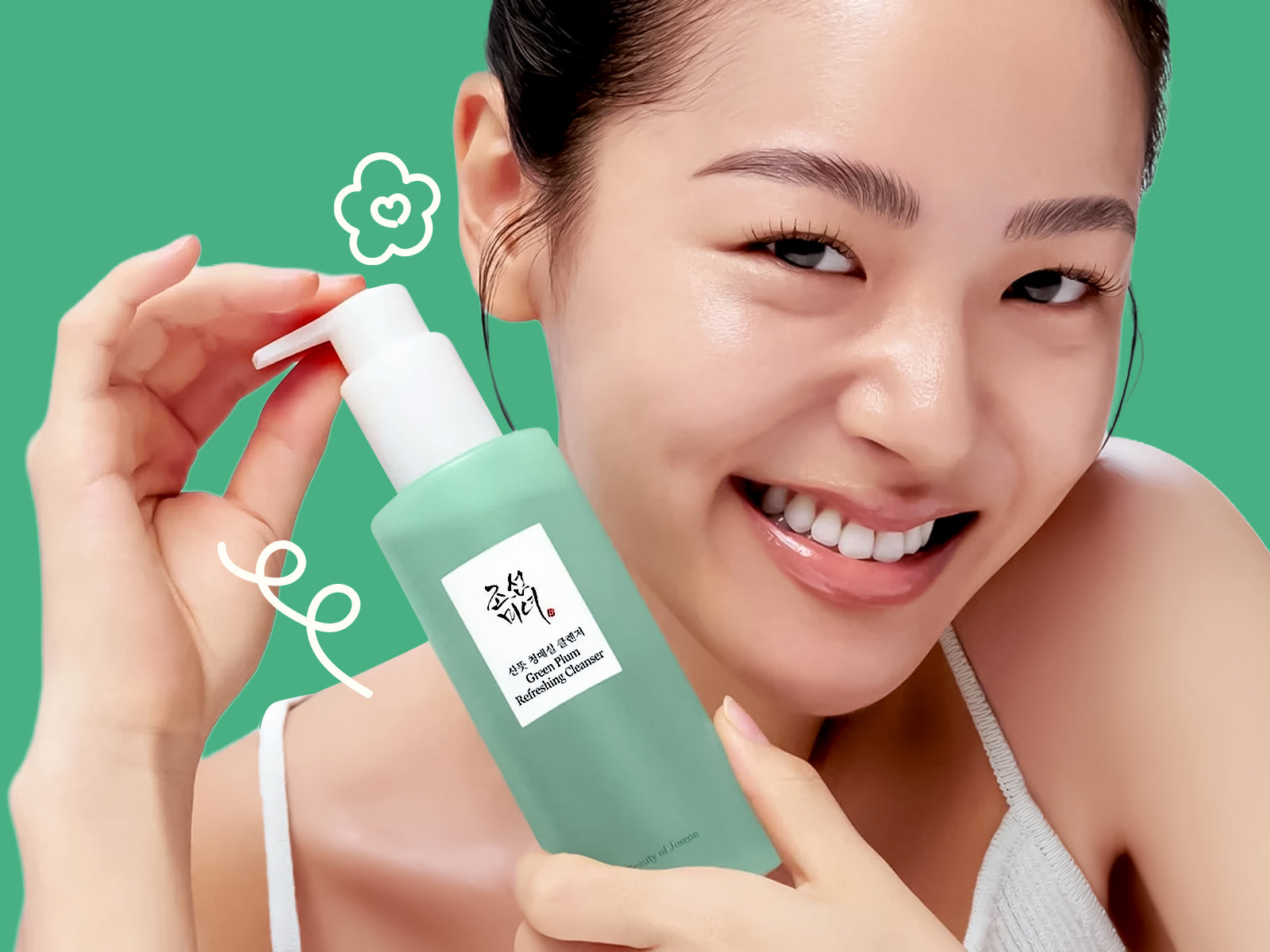 Woman holding a skincare product with a green background