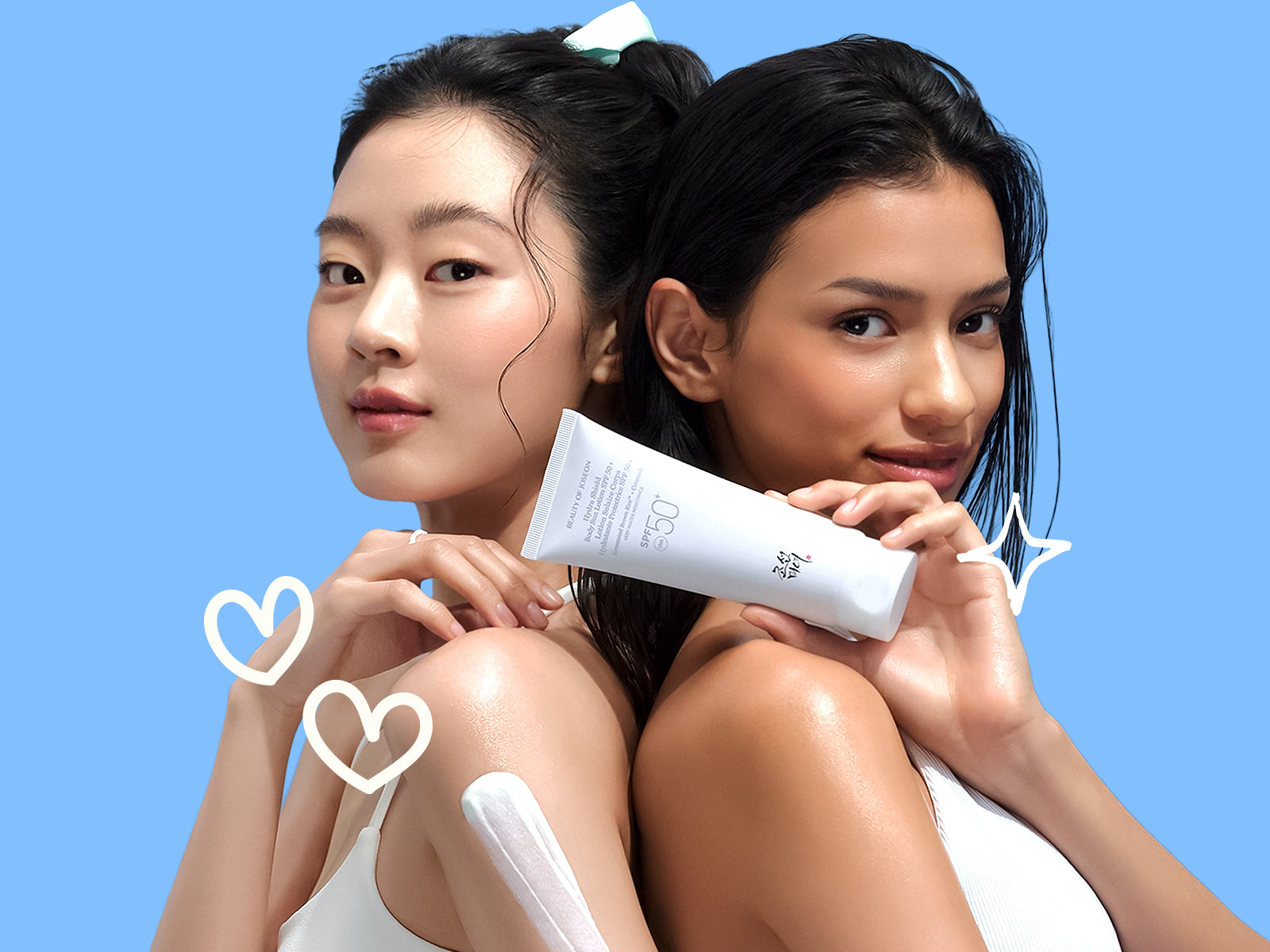 Two women pose together against a bright blue background, holding a skincare product tube between them, with white heart and sparkle doodles around the image.