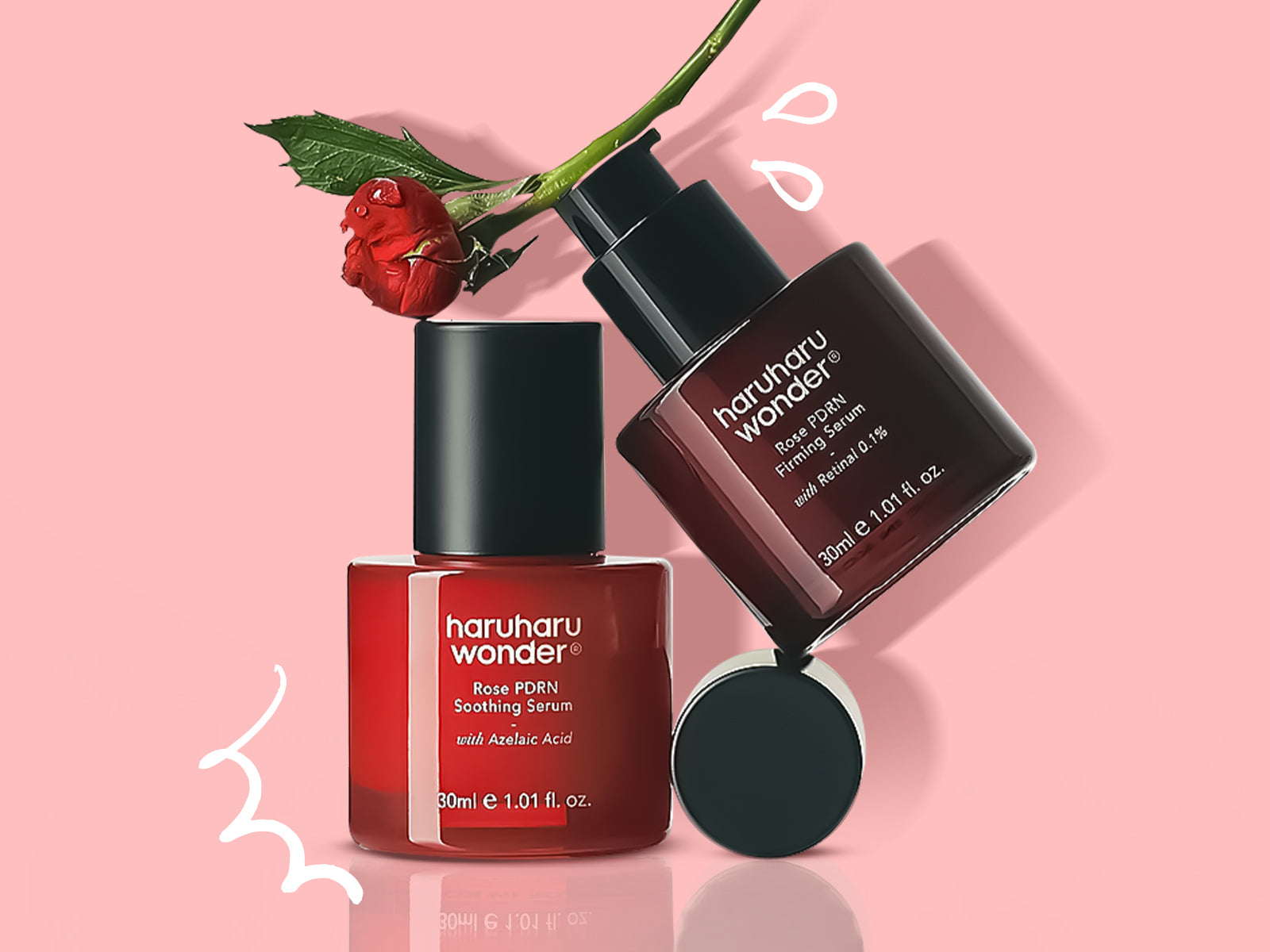 Two skincare bottles with a red flower on a pink background