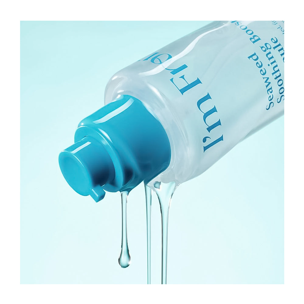 A clear plastic pump bottle with a bright blue cap, shown tilted with liquid dripping from the nozzle against a pale blue background. Blue text on the bottle reads 'I'm F**k Easy' and 'Soothing Boost'.