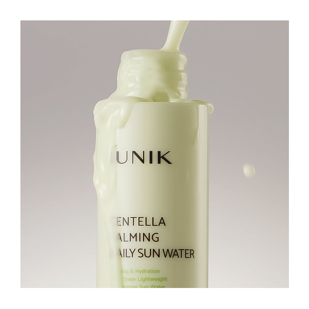UNIK Centella Alming Daily Sun Water bottle with dropper on a gray background
