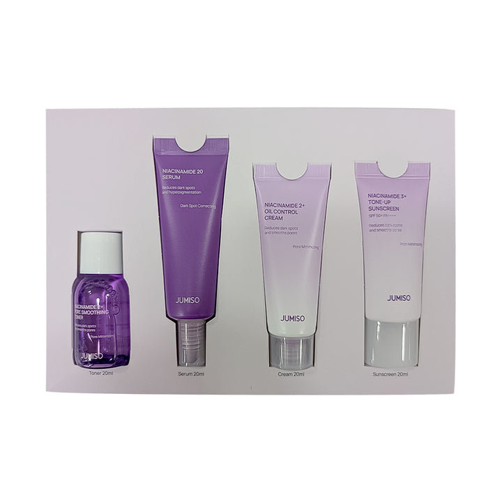 Set of JUNISO skincare products including serum, cream, and toner on a white background