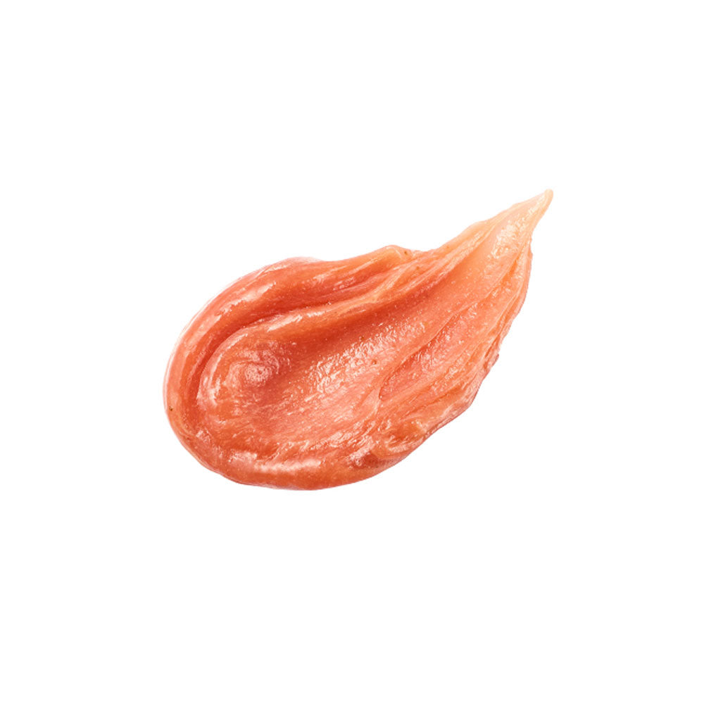 Orange-colored cosmetic cream swatch on a white background