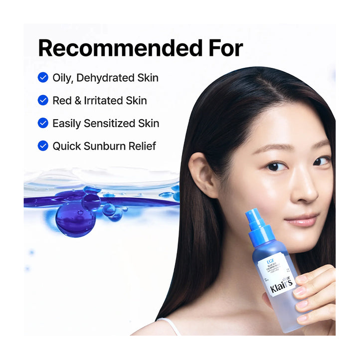 A woman with clear skin holds a bottle of Klat&