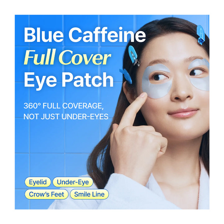 A promotional graphic for Blue Caffeine Full Cover Eye Patches, showing a woman applying or wearing light blue patch stickers around her eyes and on her forehead against a blue tiled background.