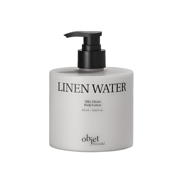 A bottle of objet by saandal Linen Water Silky Cream Body Lotion with a black pump dispenser on a clean white background.