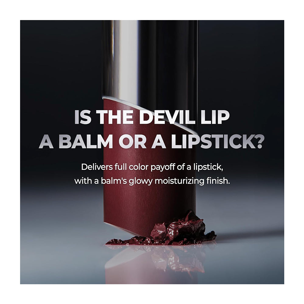 A cosmetic product shot featuring a dark red lipstick tube standing on a reflective surface with dark red balm smeared at its base. Large white text reads, &