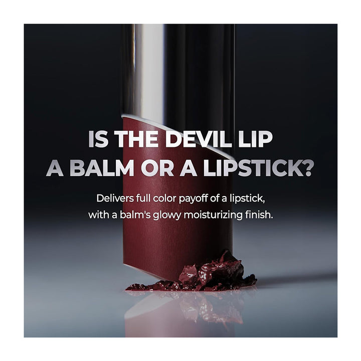 A cosmetic product shot featuring a dark red lipstick tube standing on a reflective surface with dark red balm smeared at its base. Large white text reads, &