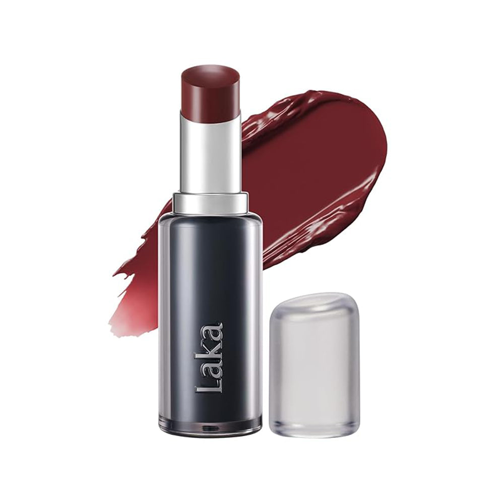 Laka lipstick in a dark berry red shade, shown with the cap off next to a clear cap and a matching lipstick smear on a white background.