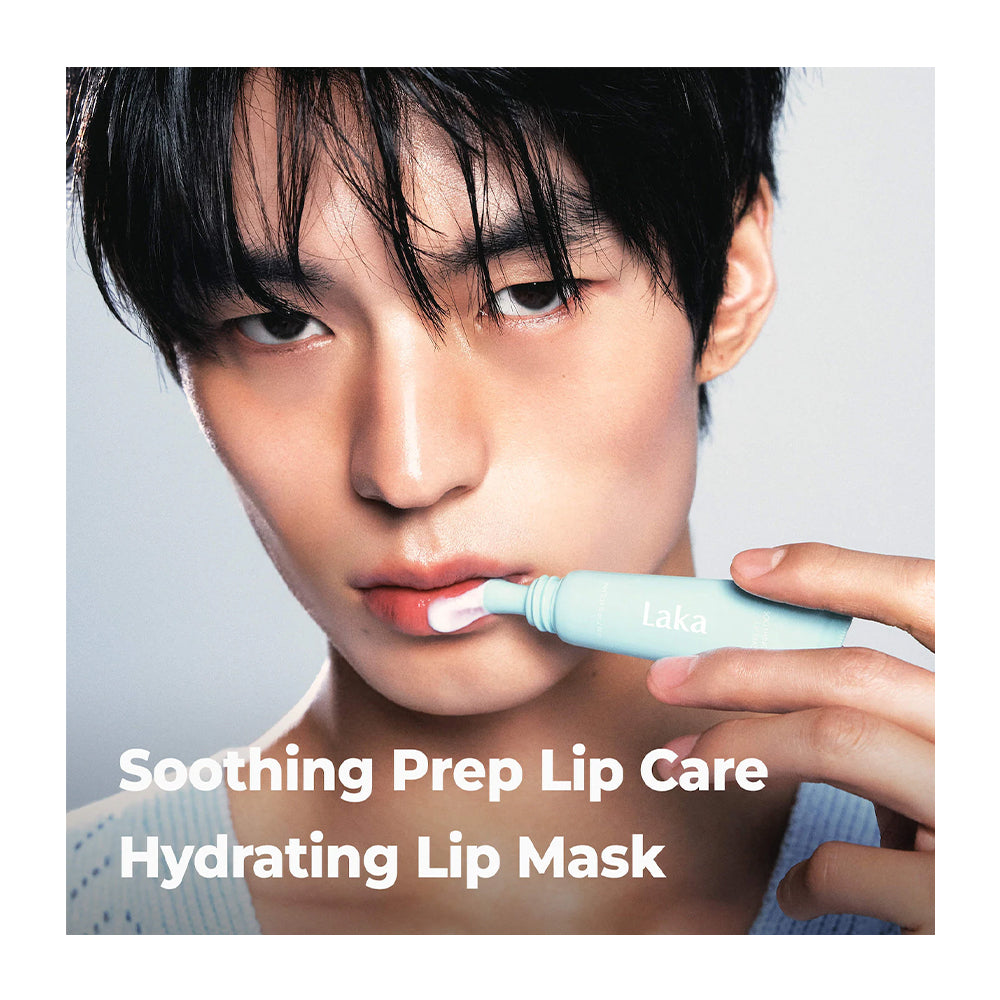 A close-up of a person holding a light blue lip care tube near their lips, with text reading 'Soothing Prep Lip Care Hydrating Lip Mask' and the brand name 'laka' visible on the tube.