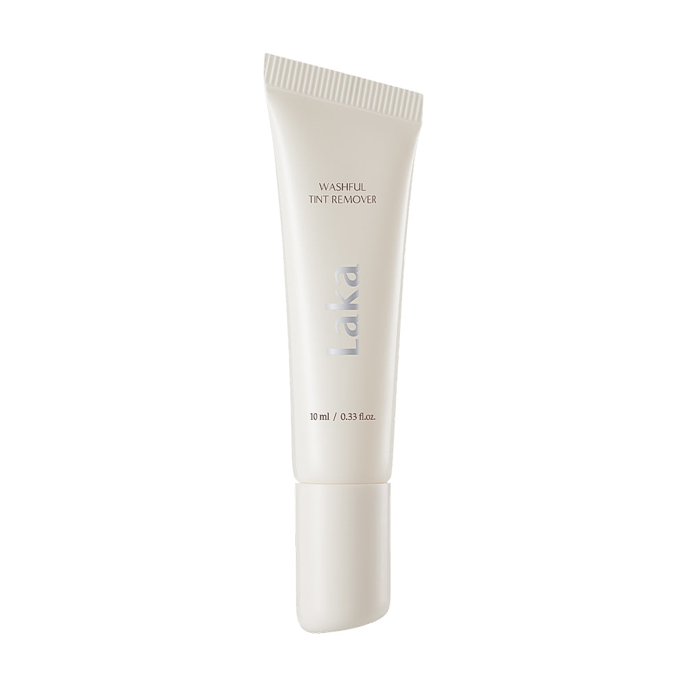 A white squeeze tube of Laka Washful Tint Remover on a solid white background.