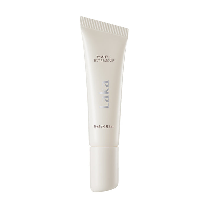 A white squeeze tube of Laka Washful Tint Remover on a solid white background.