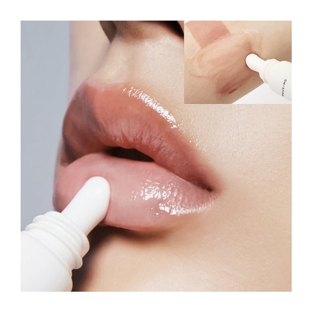 Close-up of glossy nude lips with a white lip product applicator touching the lower lip, plus a small inset showing the product tube tip on skin.