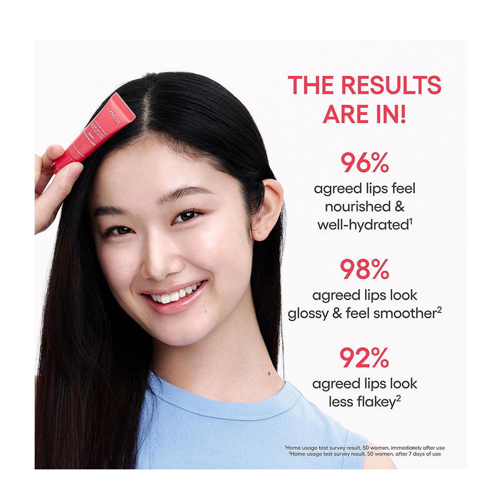 A smiling woman with long dark hair holds a red tube near her hair part, with text on the right reading &