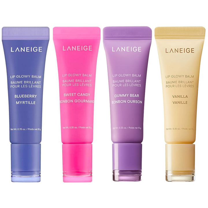 Four Laneige Lip Glowy Balm tubes in blueberry, sweet candy, gummy bear, and vanilla flavors, arranged side-by-side on a white background.